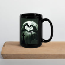 Load image into Gallery viewer, zombie hands making a heart black coffee mug for goths ghost hunters and Halloween fans