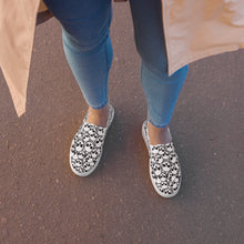 Load image into Gallery viewer, Covered in Skulls Women’s slip-on canvas shoes: Embrace Sinister Style and Comfort! 👻👟
