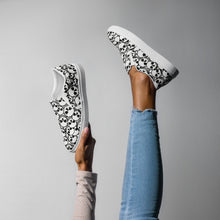 Load image into Gallery viewer, Covered in Skulls Women’s slip-on canvas shoes: Embrace Sinister Style and Comfort! 👻👟

