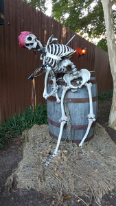Pirate skeleton sitting on a barrel Halloween stock photo