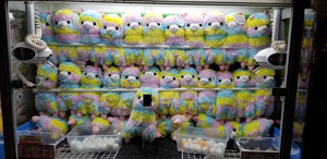 Crane Game Full of Rainbow Lamas Free Stock Image