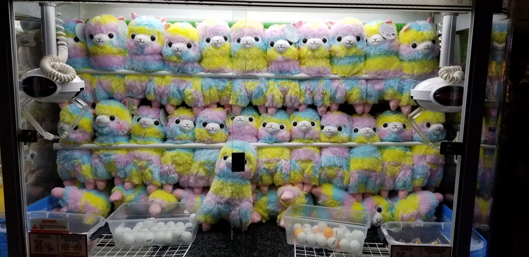 Crane Game Full of Rainbow Lamas Free Stock Image