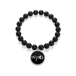 The word Witch in white creepy letters on a black  Matte Onyx Bracelet