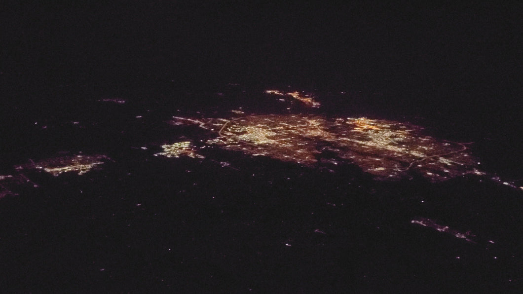 Flying over a city night time